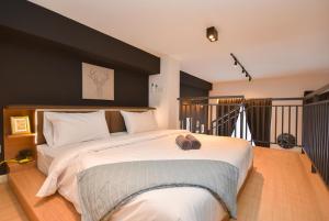 Ένα ή περισσότερα κρεβάτια σε δωμάτιο στο Sunway Grid Loft Suite by Nest Home【Olympic Size Pool】