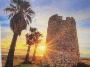 The sunrise or sunset as seen from a vendégházakat or nearby