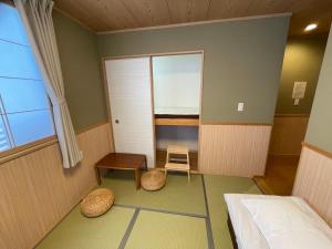 Postel nebo postele na pokoji v ubytování GuestHouse Guu
