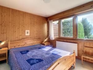 Postel nebo postele na pokoji v ubytování Hautes Cimes 113