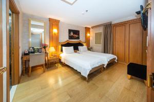 Postel nebo postele na pokoji v ubytování Aprilis Hotel - Special Category