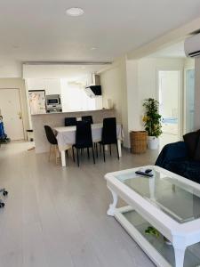 a living room with a couch and a table at Apartamento Cuidad Ciencias in Valencia