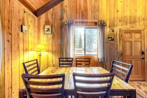 a dining room with a table and chairs and a window at Blue Pine Lodge in Joseph