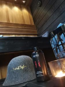 a bottle of soap and a hat on a table at Levi Secret Igloo Ruska in Levi