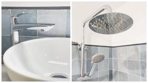 La salle de bains est pourvue d'un pommeau de douche et d'un lavabo. dans l'établissement Apartamentos Virgen Blanca, à Tolède