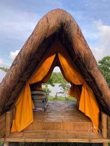 a tent that is sitting on a wooden deck at Lake Of The Woods PH Entire Island Exclusive Glamping in Cavinti