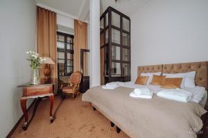 Posteľ alebo postele v izbe v ubytovaní Apartamenty Lokalna