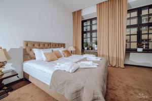 Posteľ alebo postele v izbe v ubytovaní Apartamenty Lokalna