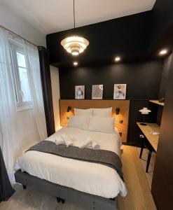 Posteľ alebo postele v izbe v ubytovaní Appartement Le Palais du Commerce