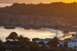 a view of a body of water at sunset at ApartPatos Luxury Home in Portimão