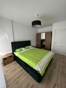 Postel nebo postele na pokoji v ubytování Garden Apartment Oradea
