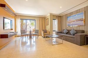a living room with a couch and a table at Dubai Marine Beach Resort & Spa in Dubai +85 photos