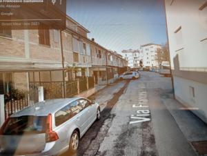 a car parked on the side of a street at Itaka in LʼAquila