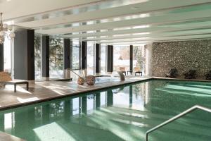 a swimming pool in a house at Carlton Hotel St Moritz - The Leading Hotels of the World in St. Moritz