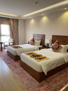 Katil atau katil-katil dalam bilik di Alsahwa Hotel