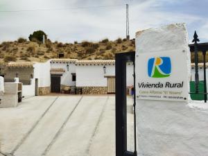 a sign in front of a building at Cuevas Baza in Baza