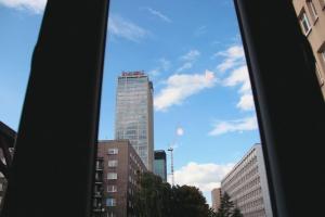 a view of a tall building from a window at *Apartamenty Kattowitz 12 in Katowice