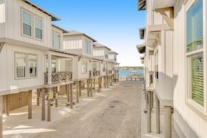 a row of houses on a street with the ocean at Cool Breeze in Gulf Shores