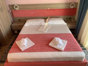Katil atau katil-katil dalam bilik di Hotel Odhisea Qeparo