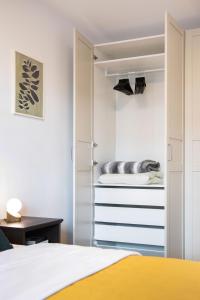 a bedroom with a bed and a closet at Design 2BDR Apartment with Balcony- FREE PARKING in Zagreb