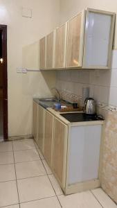 a kitchen with a sink and a counter top at حلول 9 in Abyār ‘Alī