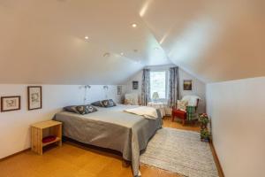 a bedroom with a large bed in a room at Majestic 3 Bedroom Villa With Sauna in Rovaniemi