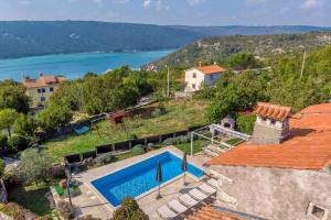 an aerial view of a house with a swimming pool at Villa Targeto with Sea View in Trget
