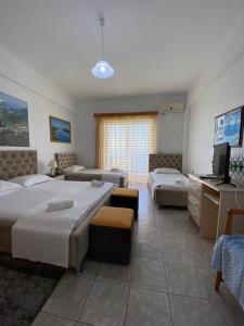 Katil atau katil-katil dalam bilik di Hotel Odhisea Qeparo