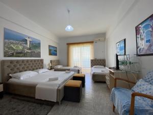 Katil atau katil-katil dalam bilik di Hotel Odhisea Qeparo