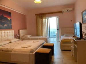 Katil atau katil-katil dalam bilik di Hotel Odhisea Qeparo