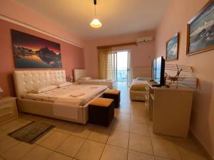 Katil atau katil-katil dalam bilik di Hotel Odhisea Qeparo