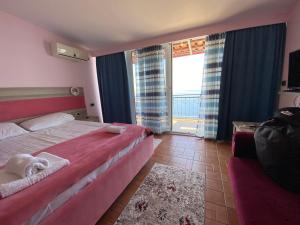 Katil atau katil-katil dalam bilik di Hotel Odhisea Qeparo