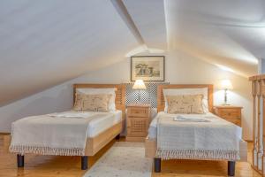 Postel nebo postele na pokoji v ubytování Apartments Slavica