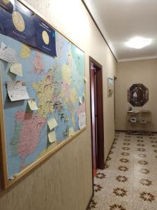 a map of the world on a wall in a hallway at Risveglio al Sole in Ragusa