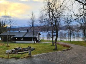 a house on the side of a road at Great house with amazing location!!Sea & mountain view! in Kvaløya