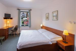 Posteľ alebo postele v izbe v ubytovaní Hotel Hvezda