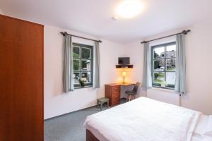 Posteľ alebo postele v izbe v ubytovaní Hotel Hvezda