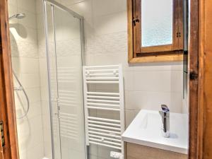 a bathroom with a shower and a sink at Chalet Individuel avec Jardin à 600m du Centre de Morzine – 2 Chambres, Wifi, Parking - FR-1-524-93 in Morzine +4 photos