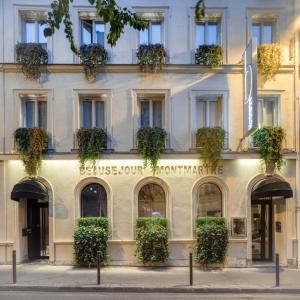 a building in paris with plants on the facade at B Montmartre in Paris