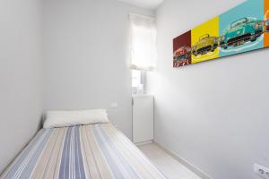 Łóżko lub łóżka w pokoju w obiekcie Luxury Frontline Poris de Abona