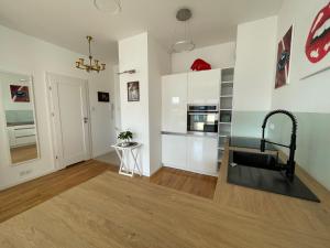 Kuchyň nebo kuchyňský kout v ubytování Wilanów Garden Apartment + 4 fotografie