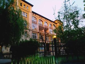 a building with a fence in front of it at Studio 4 Piętro II in Sopot