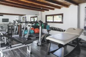 a gym with several tread machines in a room at Impressive Ibiza Villa El Zafiro 6 Bedrooms Private Gym & Views in Sant Josep de Sa Talaia