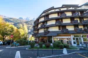 a building with a stop sign in front of it at Paradis in Chamonix