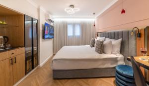 Letto o letti in una camera di The David Story Boutique