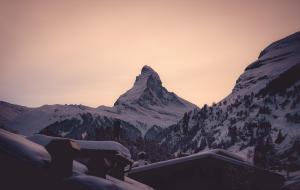 a mountain with snow on it in the sunset at the rex in Zermatt