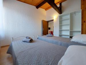 Posteľ alebo postele v izbe v ubytovaní Apartments Nono + 37 fotografií
