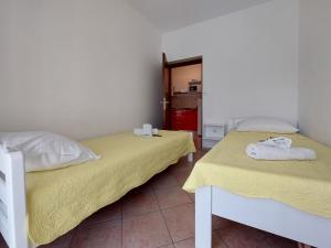 Postel nebo postele na pokoji v ubytování Apartments Nono