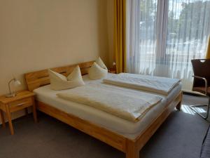 Postel nebo postele na pokoji v ubytování An der Stadthalle