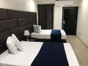 Postel nebo postele na pokoji v ubytování Starz hotel
